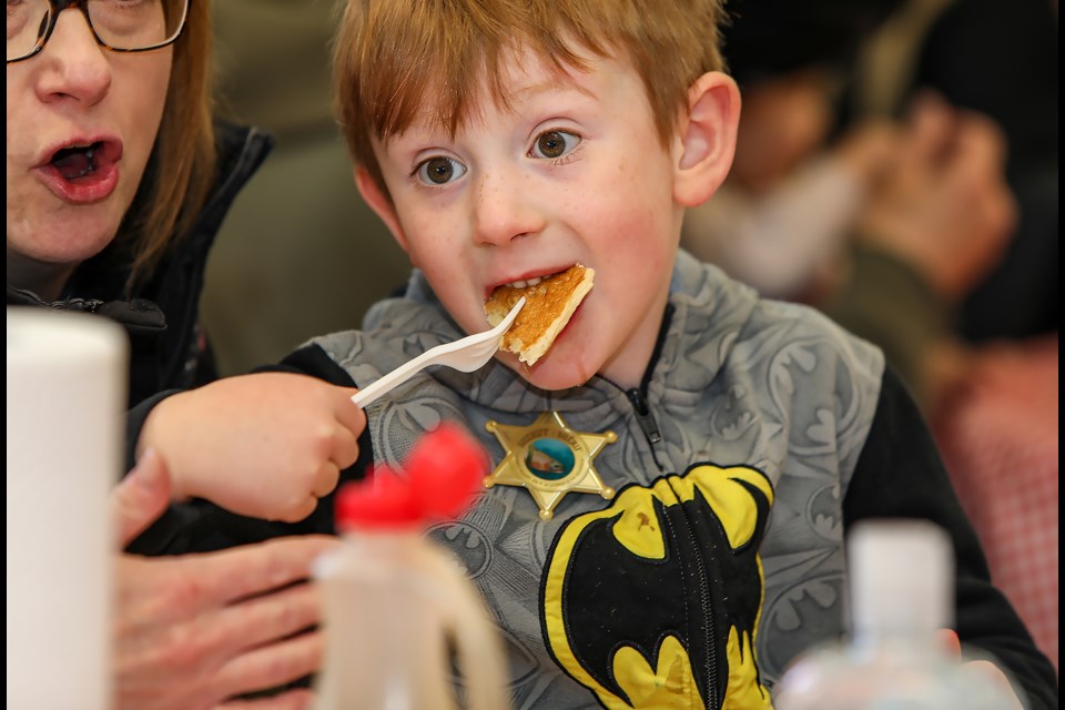Jackson Morrison-Mackay enjoys pancakes made by Banff firefighters at the annual fire prevention week pancake breakfast at the Banff Fire Hall on Saturday (Oct. 15). JUNGMIN HAM RMO PHOTO