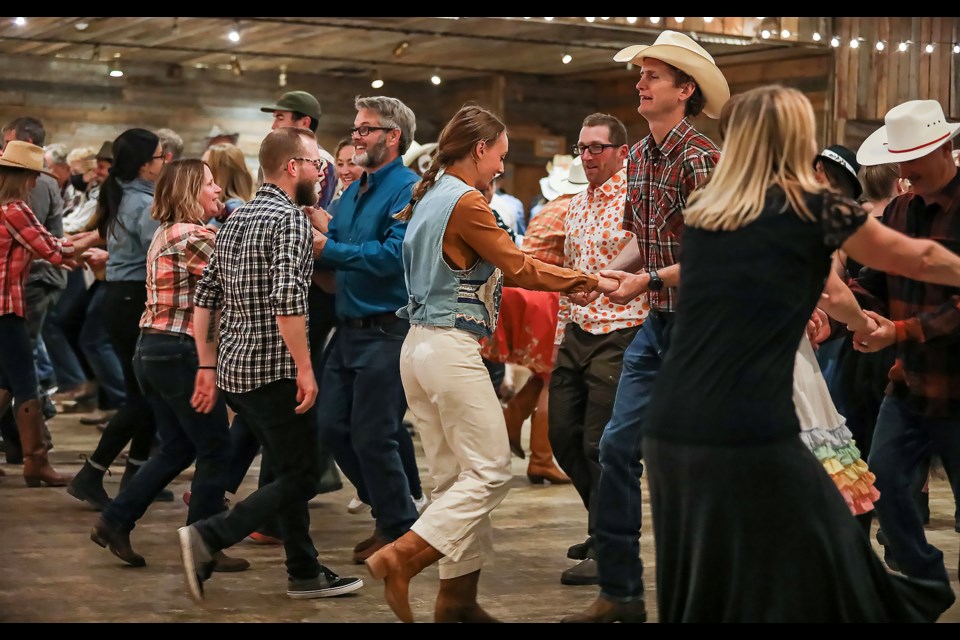 People dance "Do-Si-Dos" for the Biospheres Square Dance at the 25th anniversary of the Biosphere Institute of the Bow Valley at the Cornerstone Theatre in Canmore on Friday (Oct. 28). JUNGMIN HAM RMO PHOTO