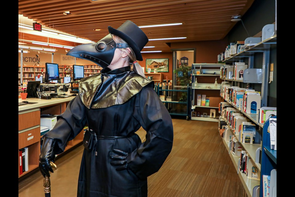 Maria Gregorish wears a plague doctor costume for Halloween at the Canmore Library on Friday (Oct. 28). JUNGMIN HAM RMO PHOTO
