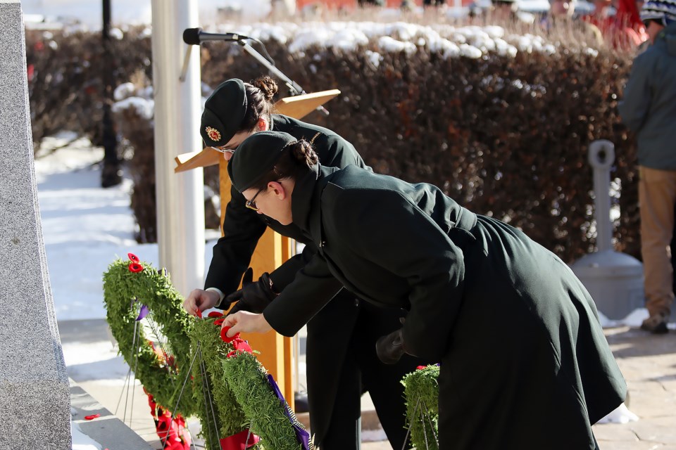 Two nurses with the Royal Canadian Medical Service pin their poppies to a wreath at the cenotaph at the Canmore Legion on Friday (Nov. 11).

GREG COLGAN RMO PHOTO