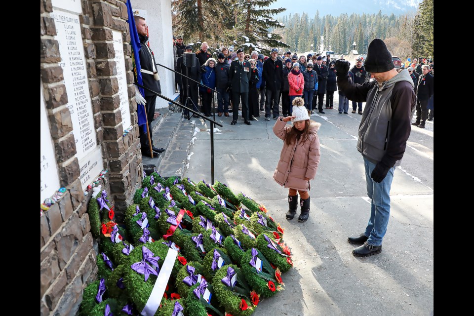 Myla Carleton, left, and Patrick Carleton salute the cenotaph after laying a wreath during the Remembrance Day events at the Royal Canadian Legion No. 26 Col. Moore branch in Banff on Friday (Nov.11). JUNGMIN HAM RMO PHOTO 