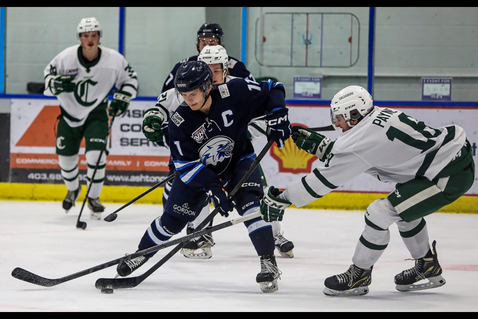 Canmore Eagles Vincent Scott, centre, looks to score on the Sherwood Park Crusaders during a game at the Canmore Recreation Centre in November 2022. RMO FILE PHOTO