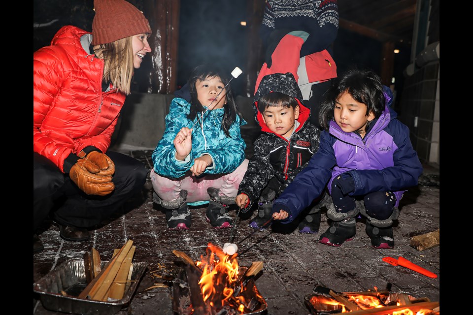 Kids grill marshmallows and eat them at the outdoor education/wild course at the Student Celebration of Learning and Open House on Nov.30. JUNGMIN HAM RMO PHOTO