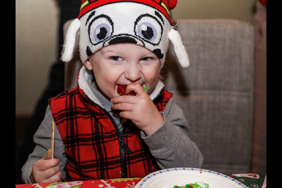 Jaxon Large eats decorated cookies at the Rotary Festival of Trees Kids Holiday Extravaganza at the Malcolm Hotel Edinburgh ballroom in Canmore on Sunday (Dec. 11). JUNGMIN HAM RMO PHOTO