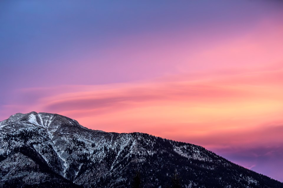 Altocumulus clouds create shades of pink and violet over Mount Lady Macdonald in 2019.

RMO FILE PHOTO