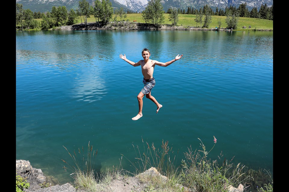 Canmore's Will Hudspith, 13, jumps into Quarry Lake during a hot summer day in Canmore on July 12. JUNGMIN HAM RMO PHOTO