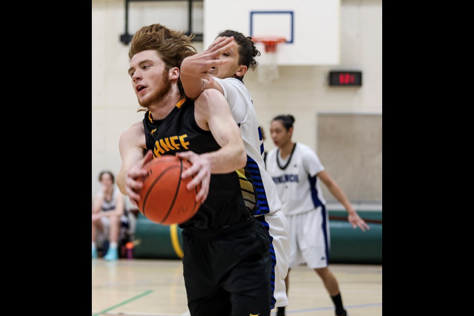 Banff Bears Noah MacFarlane, left, and OLS Avalanche Ayman Rahel battle for the ball during the JV boys gold basketball game at OLS on Thursday (Jan. 26)JUNGMIN HAM RMO PHOTO