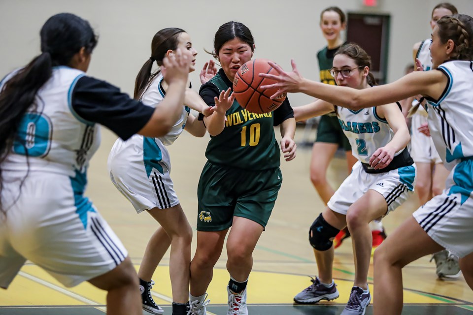 Canmore Collegiate High School Wolverines Airi Watai drives to the basket against the Lawrence Grassi Middle School Blazers during the junior girls' basketball tournament at CCHS on Friday (Jan. 27). JUNGMIN HAM RMO PHOTO