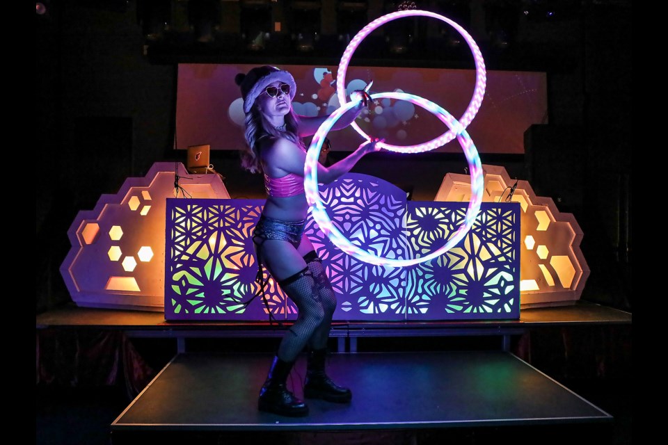 Performer Basia Banas live performs glow-in-the-dark hula hoop dance at the HeARTburn festival 2023 at artsPlace in Canmore on Saturday (Feb. 11). JUNGMIN HAM RMO PHOTO