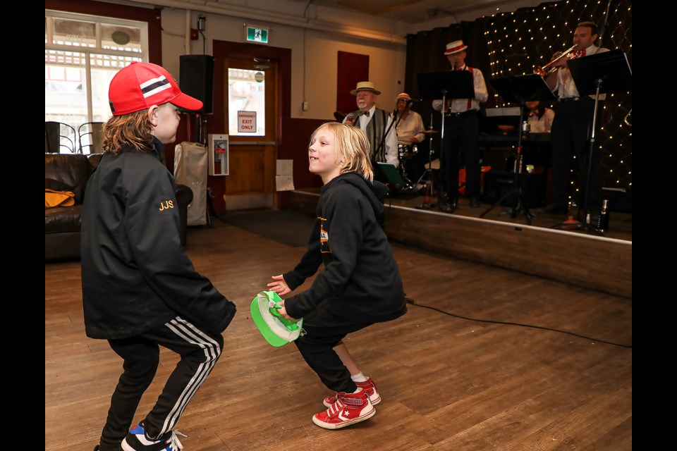 Jack shelley, left, and Mahlon Swoak enjoy dancing during Canmore Dixieland Jazz Band's performance at the Canmore Hotel on Saturday (Feb. 18).  JUNGMIN HAM RMO PHOTO