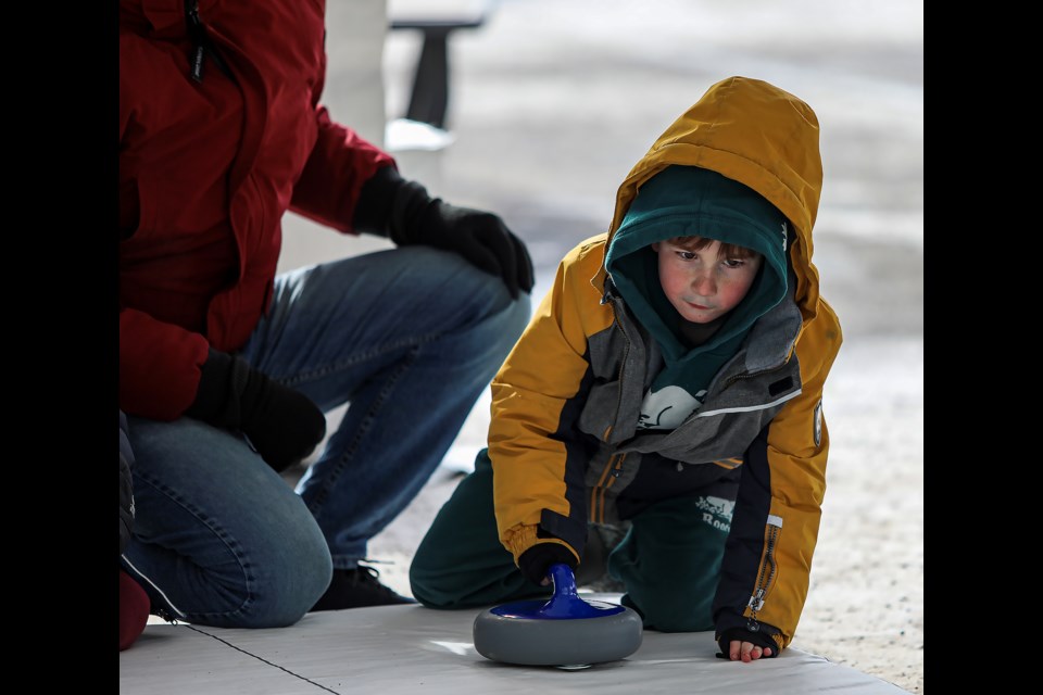 PHOTOS Throwing stones at Banff's Curling Day in Canada Photo Gallery