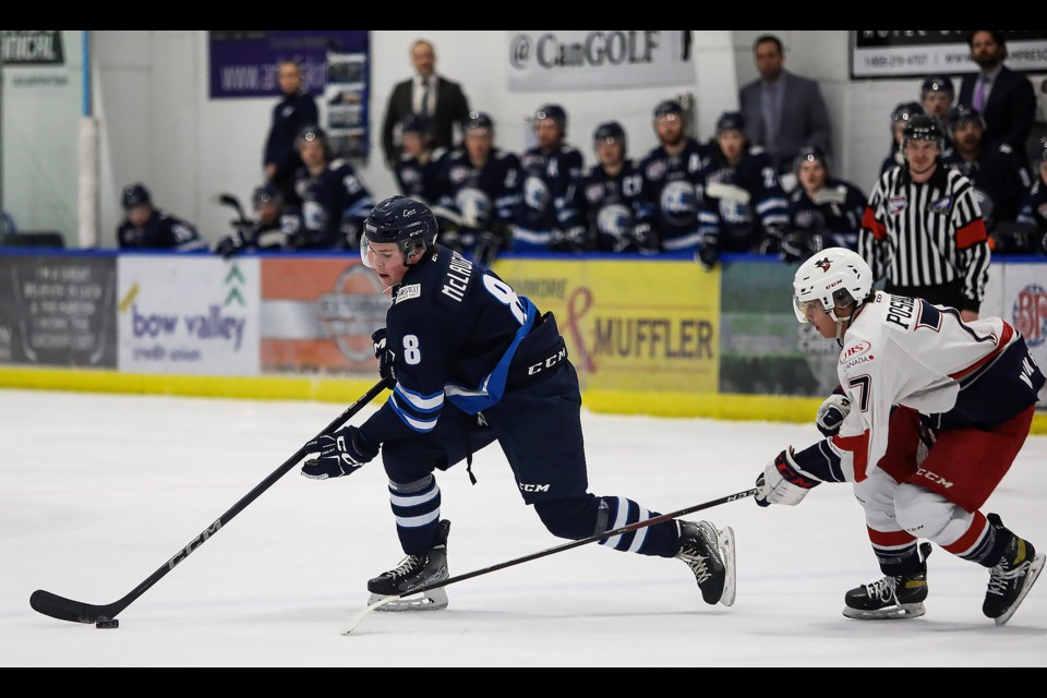 The Canmore Eagles play in their final home game of the 2022-23 season. Eagles' Finn McLaughlin carries the puck in front of Brooks Bandits' Kai Billey during a game at the Canmore Recreation Centre on Wednesday (March 1). Brooks won 4-0. JUNGMIN HAM RMO PHOTO