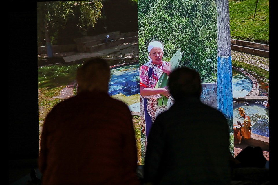 People appreciate works of the video and virtual reality exhibition  "Piña, Why is the Sky Blue?" at the opening reception at the Walter Phillips Gallery in Banff on Friday (March 3). The exhibition runs from March 3 to July 30. JUNGMIN HAM RMO PHOTO 