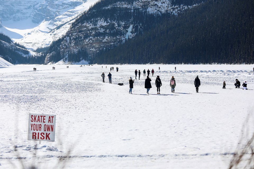 People walk on frozen Lake Louise in March 2023. RMO FILE PHOTO