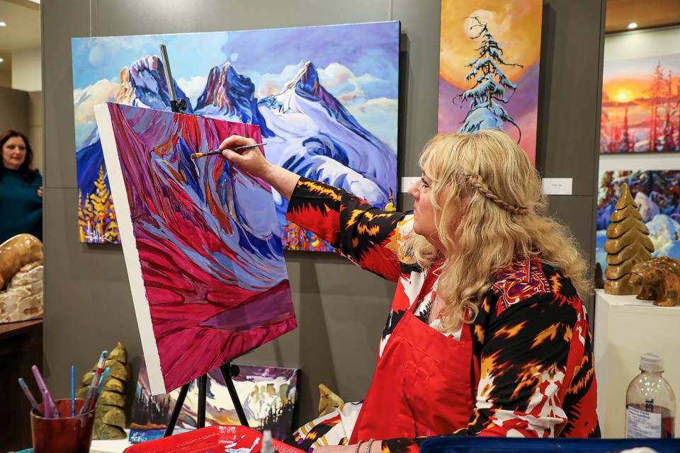 Artist Heather Pant paints at the Avens Gallery painting demonstration event in Canmore on Saturday (March 11). JUNGMIN HAM RMO PHOTO