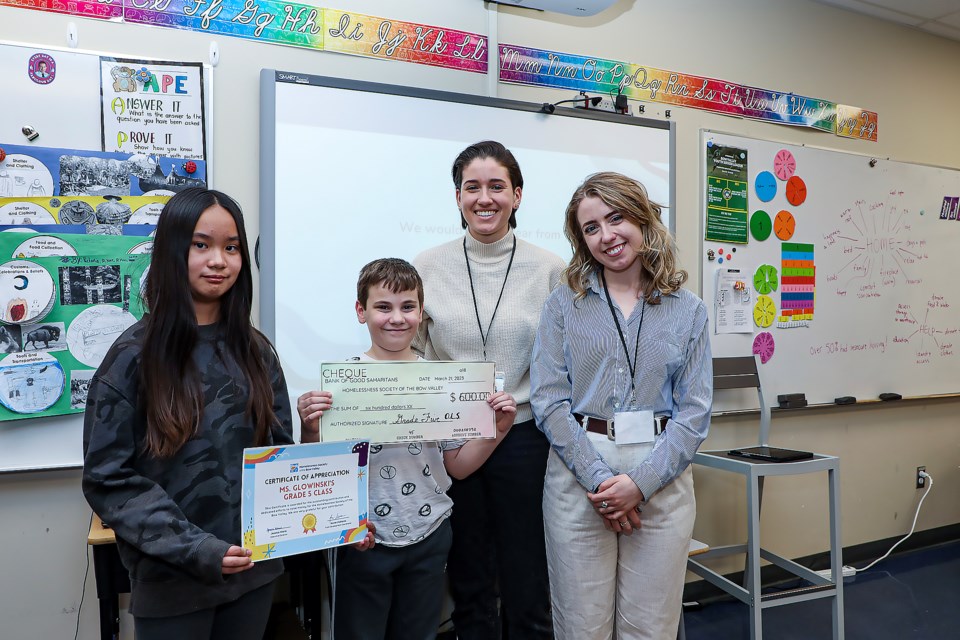 Grade 5 student Mary Villanveva, left, Mattias Giannandrea and representatives with the Homelessness Society Jessica Klaric and Annie Vlahiotis pose at Our Lady of the Snows Catholic Academy on Tuesday (March 21). JUNGMIN HAM RMO PHOTO