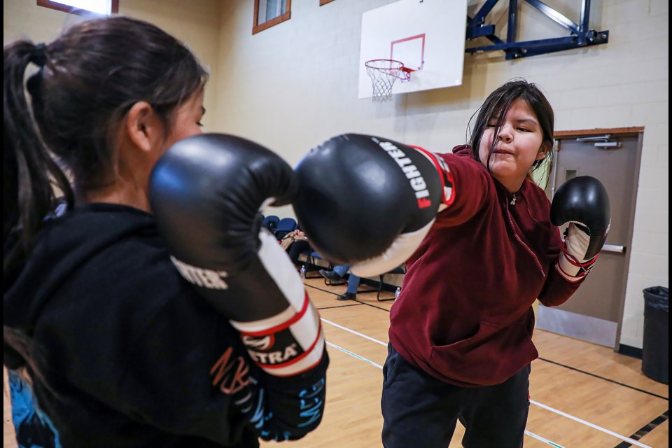 Jewel Beaver, right, and Kyra Beaver do straight boxing training during practice for the Bearspaw Boxing Club at the Bearspaw Youth Centre in Mînî Thnî  (Morley) on Thursday (March 30). JUNGMIN HAM RMO PHOTO