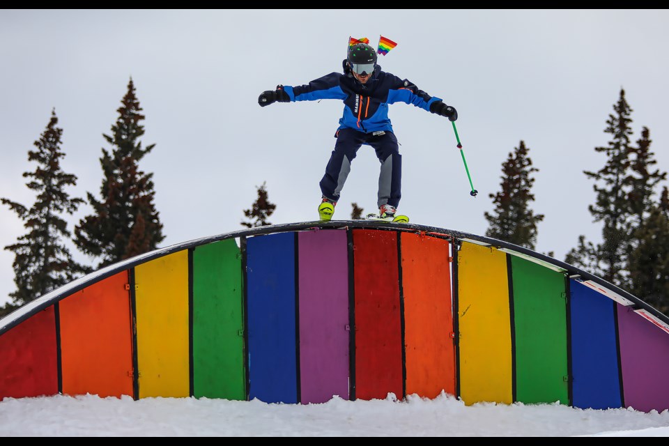 Thibault De Sainte Maresville rides the rainbow rail at the first Pride Ski Day at Mount Norquay Ski Resort in Banff on Friday (March 31). JUNGMIN HAM RMO PHOTO  
