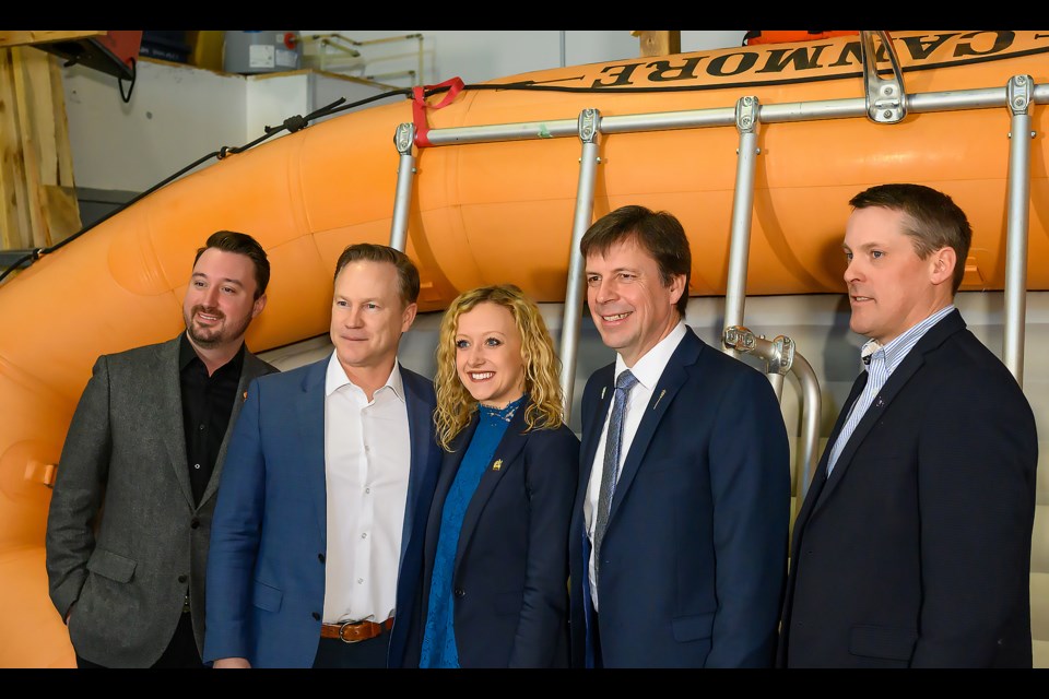 From left to right, Shae Bird, Jon Mamela, Miranda Rosin, Todd Loewen, and Nate Horner, pose for photos in Dead Man's Flats after a talk on Tuesday (April 4). MATTHEW THOMPSON RMO PHOTO