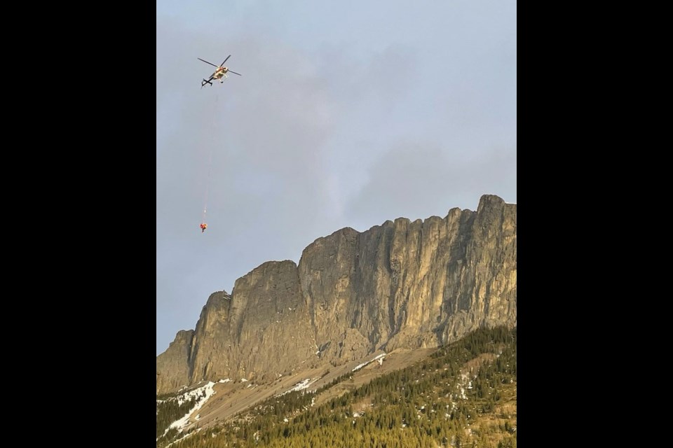 An Alpine helicopter slings hikers off Mount Yamnuska during a rescue by Kananaskis Mountain Rescue April 10. 

PHOTO COURTESY KANANASKIS MOUNTAIN RESCUE