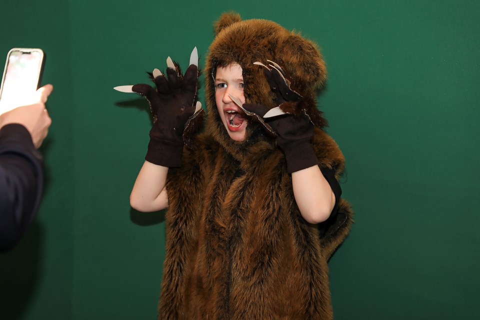 Morgan Stafford, 6, dresses up in a bear costume at Bear Day at the Canmore Nordic Centre day lodge on Saturday (April 22).  JUNGMIN HAM RMO PHOTO 