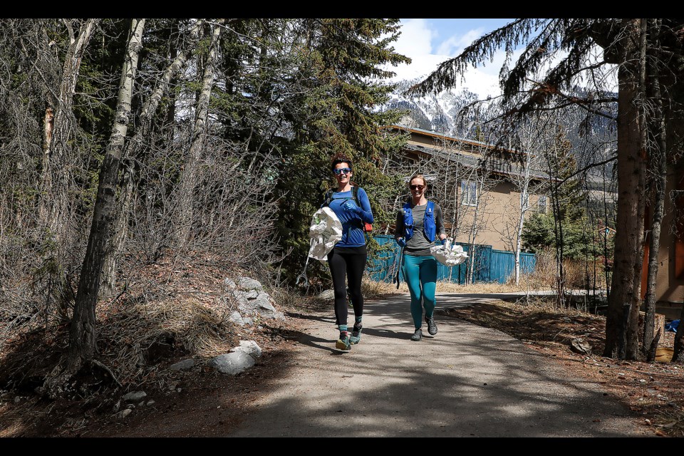 Emma Coates, left, and Haley Milko go jogging to pick up trash during the sixth annual Strides plogging event in Canmore on Saturday (April 22). Plogging is a Swedish term for an activity combining jogging and picking up litter. JUNGMIN HAM RMO PHOTO 