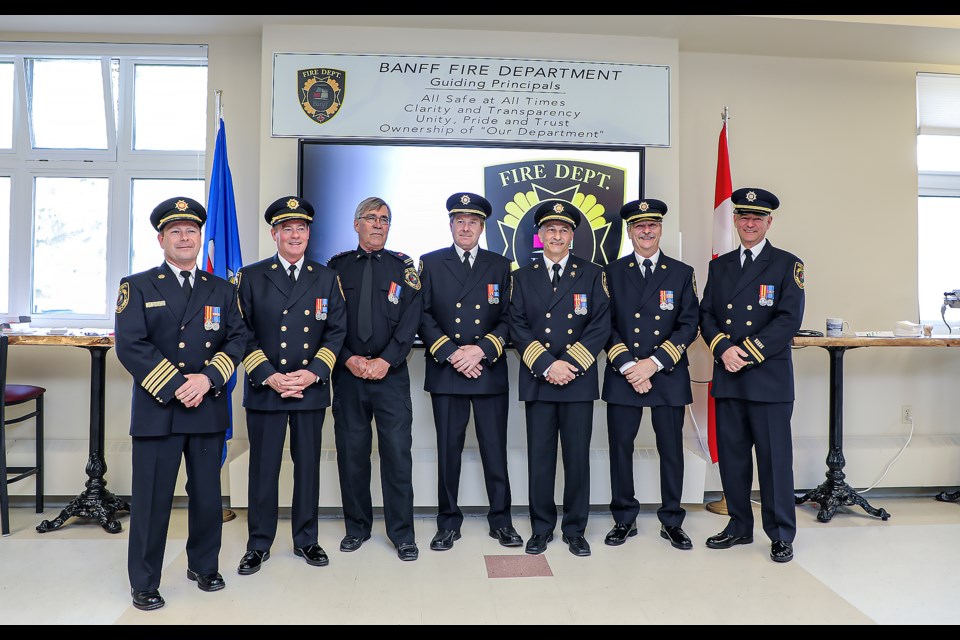 Fire Services Exemplary Service Award winners pose at the Banff Fire Hall on Tuesday (April 25). From left: Deputy Chief Russ Geyer, Deputy Chief Mike Geisler, retired Captain Jim Abelseth, Captain Warren Geyer, Chief Silvio Adamo, Assistant Chief Bruce Smith and Captain Dave Shakotko. JUNGMIN HAM RMO PHOTO