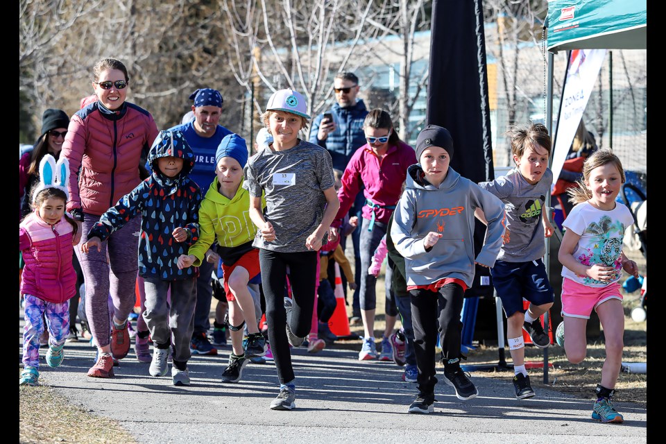 Runners race out of the starting line for the one-kilometre run at the 8th edition of the Equinox Run at École Notre-Dame des Monts in Canmore on Saturday (April 29). JUNGMIN HAM RMO PHOTO