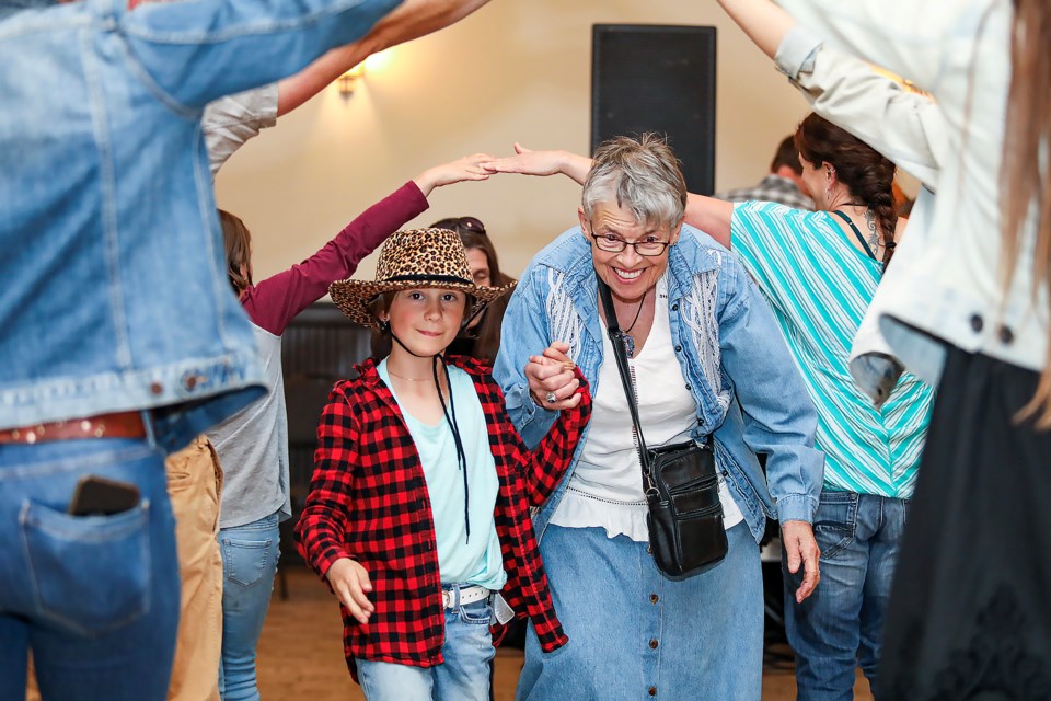 Tatum Aikman, 8, and Judy Brese dance during the Canmore Hip to Be Square Dance event at the Canmore Miners' Union Hall on on Friday (May 5). All proceeds from this dance event will benefit Pine Tree Players. JUNGMIN HAM RMO PHOTO