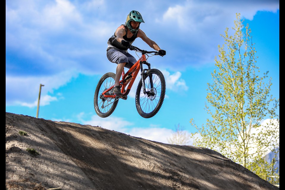 Canmore's Mike Lutsch flies over a steep and technical trail at the Canmore Nordic Centre's bike skills park on Friday (May 12). JUNGMIN HAM RMO PHOTO 