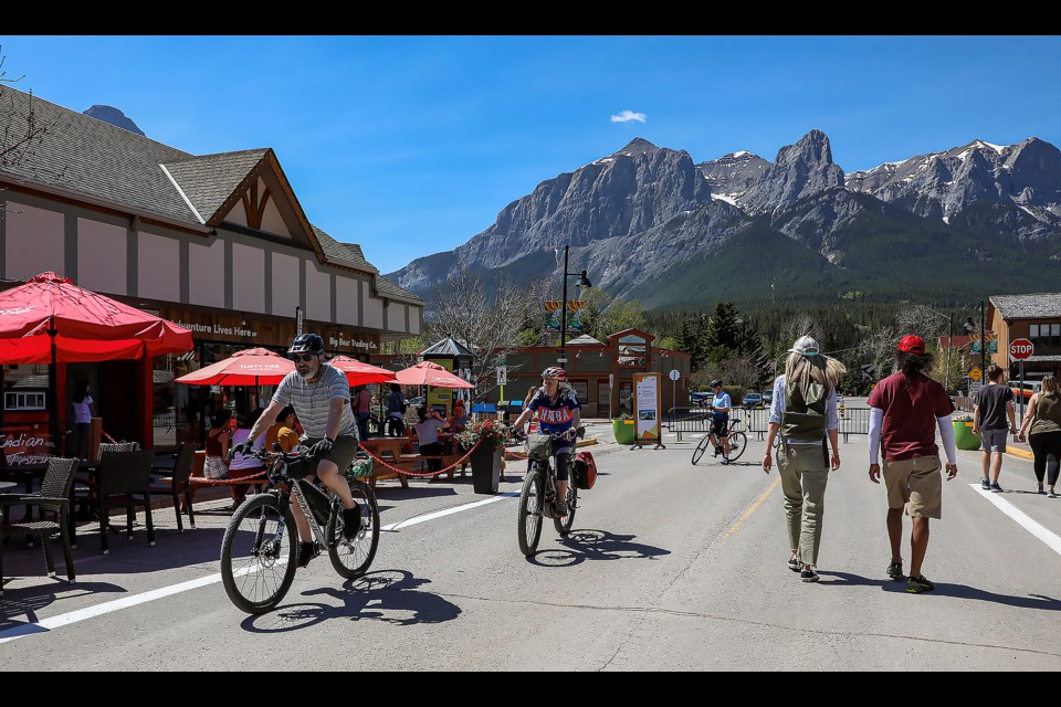 People walk down Main Street in Canmore on Saturday (May 13) for the first week of the pedestrian zone. JUNGMIN HAM RMO PHOTO 