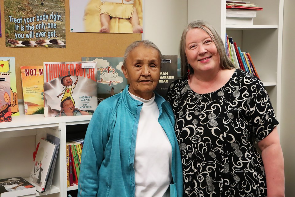 Îyârhe Nakoda Elder Jackie Rider, left, and Marigold Library System Indigenous outreach specialist Rose Reid, pose for a photo at the Mînî Thnî Book Deposit at Goodstoney Lodge Wednesday (May 24).

JESSICA LEE RMO PHOTO