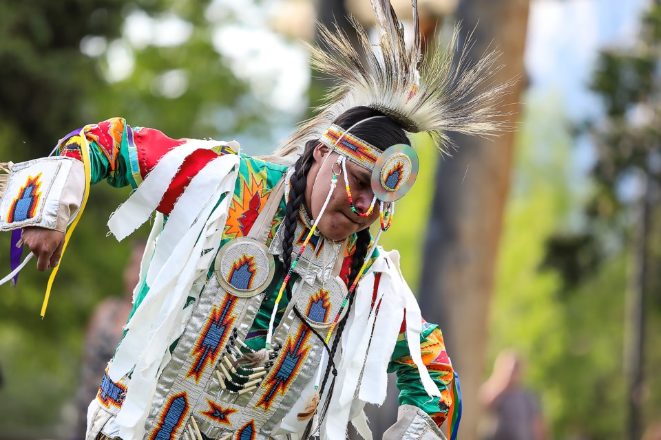 Jacob E Amos performs a traditional grass blessing dance during the teepee raising ceremony at the Northwest Mounted Police (NWMP) Barracks in Canmore on Saturday (June 10). JUNGMIN HAM RMO PHOTO