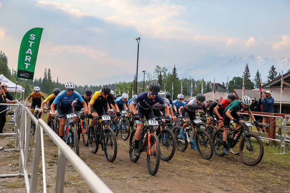 Elite men mountain bikers burst out of the start line at the 2023 Canmore Coupe Canada Cup XCC on Thursday (June 15) at the Canmore Nordic Centre. JUNGMIN HAM RMO PHOTO