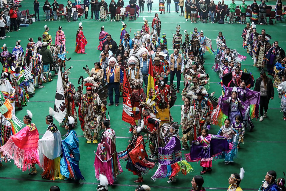 The grand entry procession makes its way into the hall to celebrate National Indigenous Peoples' Day at Chief Goodstoney Rodeo Centre in Mînî Thnî (Morley) on Wednesday (June 21). JUNGMIN HAM RMO PHOTO