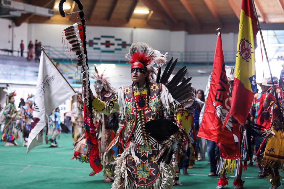 The grand entry procession makes its way into the hall to celebrate National Indigenous Peoples Day at Chief Goodstoney Rodeo Centre in Mînî Thnî (Morley) on Wednesday (June 21). JUNGMIN HAM RMO PHOTO
