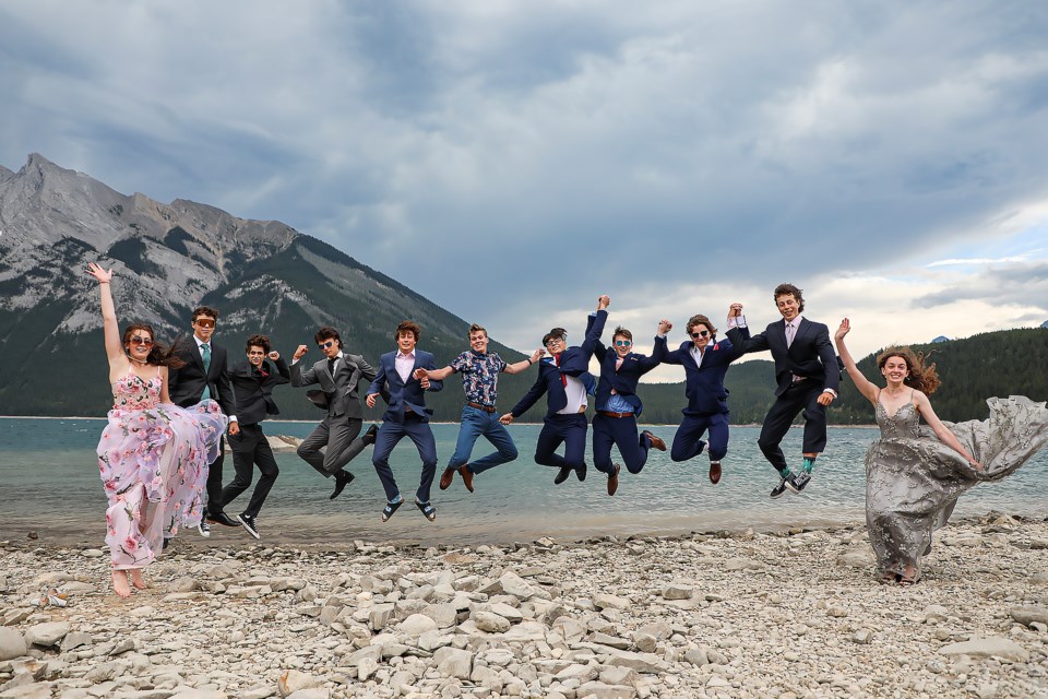 The graduates of École Notre-Dame des Monts jump at Lake Minnewanka in Banff National Park on Wednesday (June 28).From left: Sasha Boucher, Benjamin Sylvester, Akin Gelinas, Peter Gosse, Felix Clement, Benjamin  Brousseau, Erie Gonzalez, Joshua Graham, Tristan Hache, Baptiste Cais and Madeleine Cross. JUNGMIN HAM RMO PHOTO