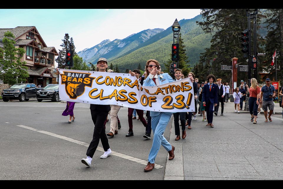 Banff Community High School graduates head down Banff Avenue for the graduates parade in on Friday (June 30). JUNGMIN HAM RMO PHOTO