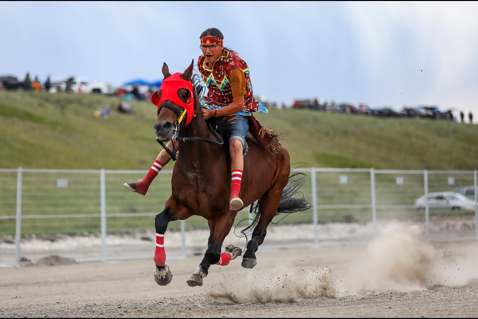 Reikel Poucette, North Star Indian Horse Relay team's rider, completes three laps on a course while riding a horse bareback at the Mînî Thnî (Morley) Îyârhe (Stoney) Nakoda First Nation Indian Horse Relay Racing at the horse track near the Goodstoney Rodeo Centre in Îyârhe Nakoda First Nation on Sunday (July 2). JUNGMIN HAM RMO PHOTO