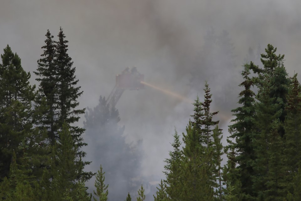 Firefighters battle a massive blaze at the Skiing Louise-owned Charleston Residence on Village Road in Lake Louise on Monday (July 3). GREG COLGAN RMO PHOTO