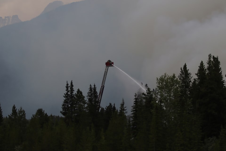 Firefighters battle a massive blaze at the Skiing Louise-owned Charleston Residence on Village Road in Lake Louise on Monday (July 3). GREG COLGAN RMO PHOTO
