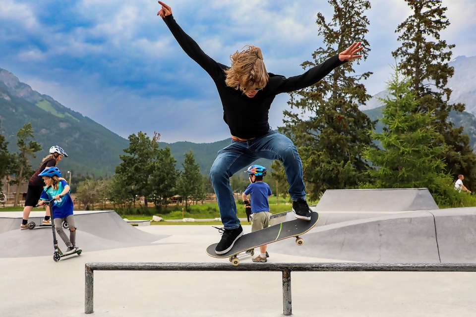 Banff skateboarder Jayce Downs performs a trick while riding the rails during the skatepark community bbq in Banff on Thursday (July 6). JUNGMIN HAM RMO PHOTO