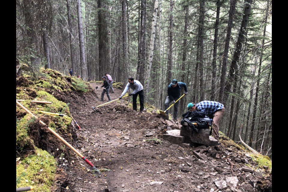 Friends of Kananaskis Country volunteers work on the Cloudline trail, which opened to the public June 30. Building the new trail was a partnership between Alberta Parks, the Friends, and the Canmore and Area Mountain Bike Association. 

PHOTO COURTESY FRIENDS OF K-COUNTRY