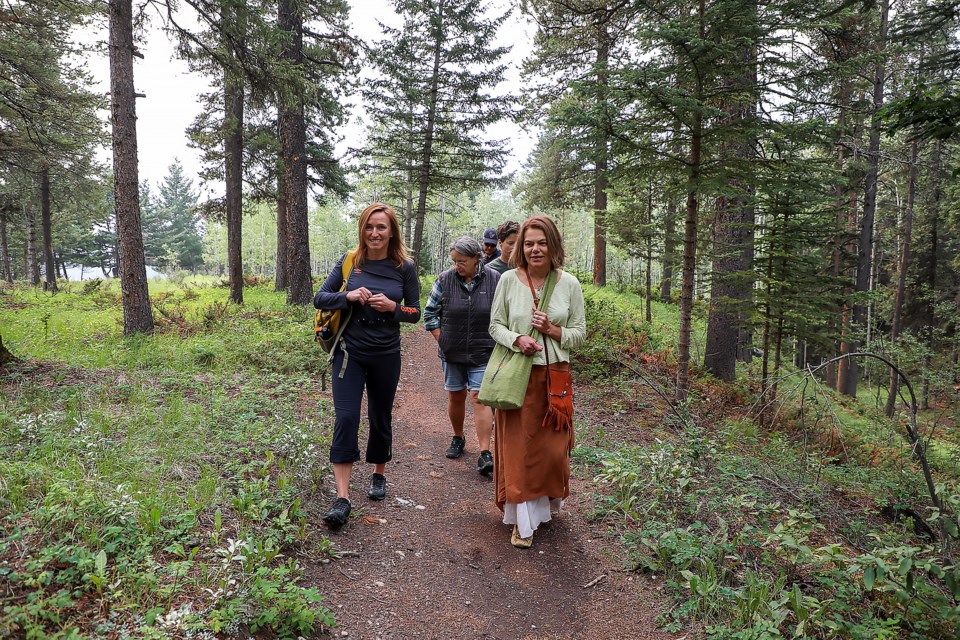 People participate in a wild medicinal and edible plants walk to learn how Rocky Mountain plants nourish and heal humans along the Spur Line Trail in Canmore on Thursday (July 13). JUNGMIN HAM RMO PHOTO