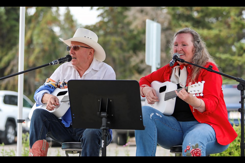 Shane Coultis, left, and Liz Wilson perform at Pursuit's annual Stampede barbecue in Banff on Friday (July 14). JUNGMIN HAM RMO PHOTO