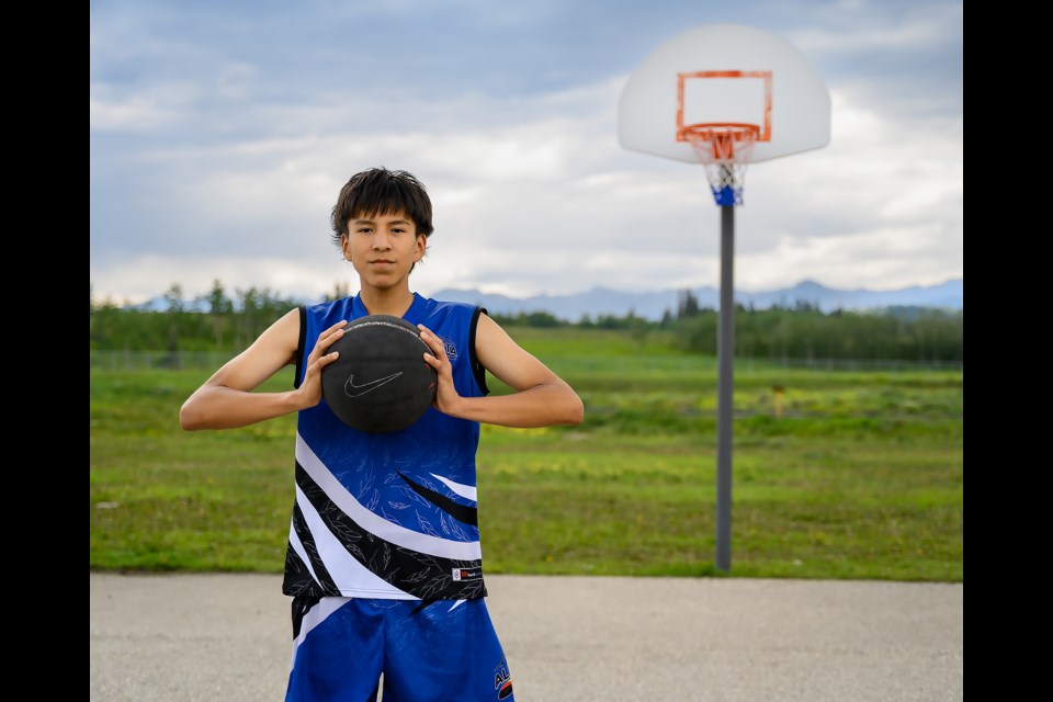 Jonah Chiniquay, 16, poses for a portrait at the Nakoda Elementary School outdoor basketball courts in Mînî Thnî on Tuesday (July 25). MATTHEW THOMPSON RMO PHOTO
