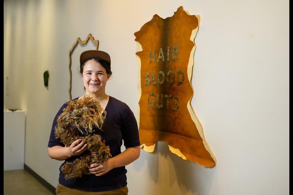 Morgan Possberg Denne poses for a portrait while setting up their gallery at artsPlace in Canmore on Tuesday (July 25). MATTHEW THOMPSON RMO PHOTO