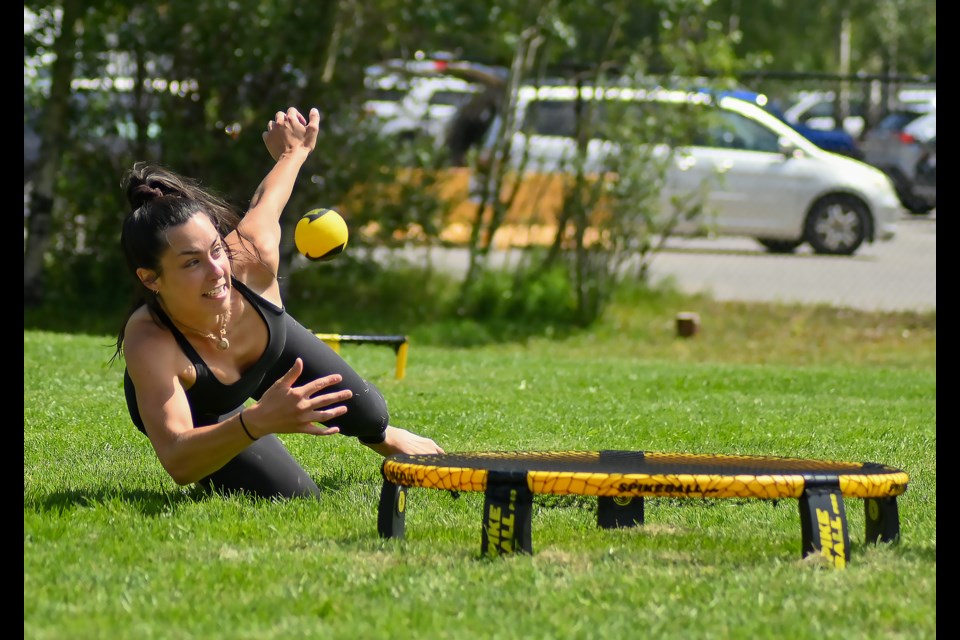 Beatrice Sasseville dives for the ball during a game of Spikeball in a tournament thrown by Canmore-Banff Regional Association Canadienne-Française de l’Alberta at the Canmore Recreation Center on Saturday (July 29). MATTHEW THOMPSON RMO PHOTO