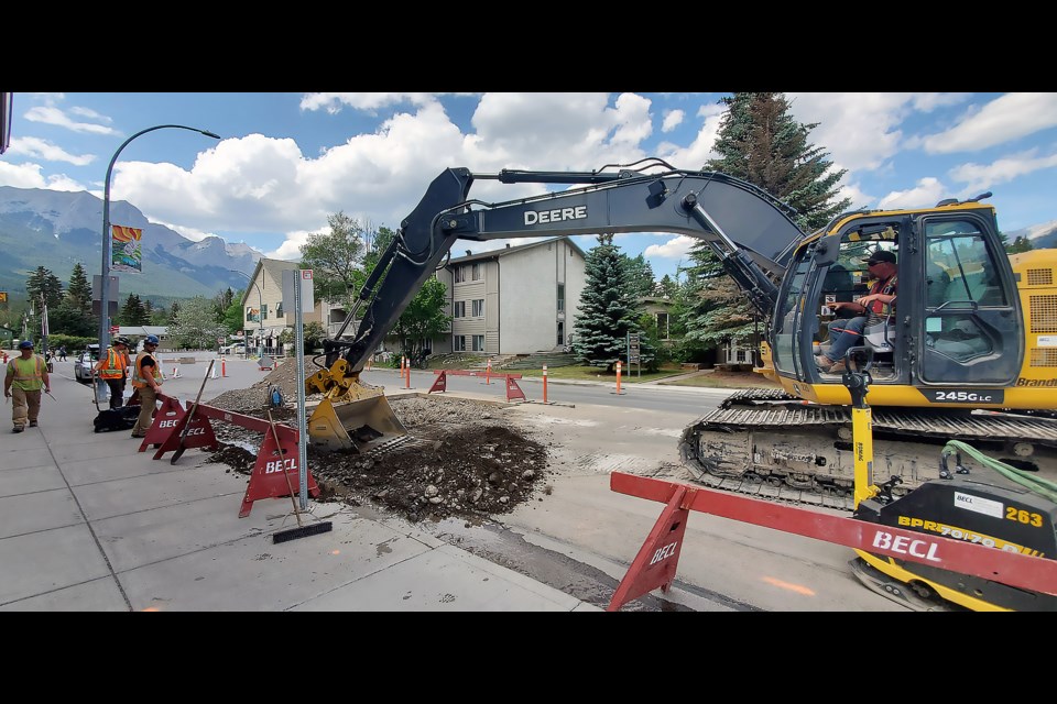 A crew works on a burst pipe on 10th Avenue in Canmore June 13 when the Town was on a municipal-wide water restriction. GREG COLGAN RMO PHOTO