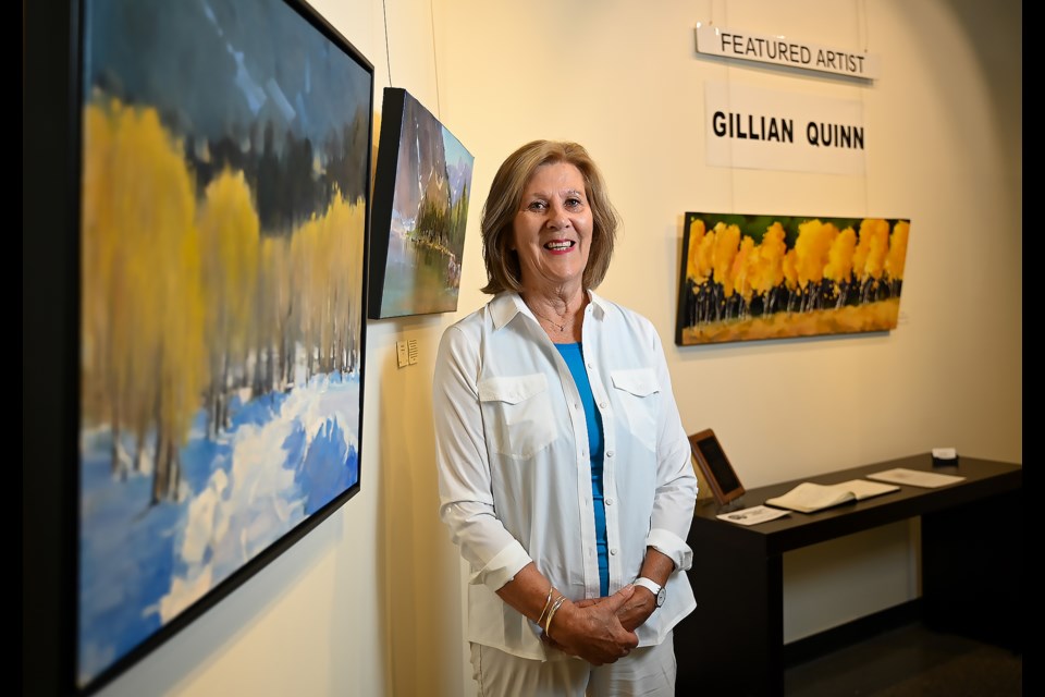 Gillian Quinn poses for a photo in the Canmore Art Guild Gallery at the Elevation Place on Friday (Aug. 11). Quinn is the featured artist for the month of August. MATTHEW THOMPSON RMO PHOTO